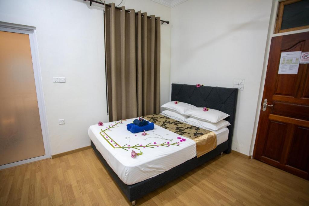 Postel nebo postele na pokoji v ubytování iHaven Thulusdhoo