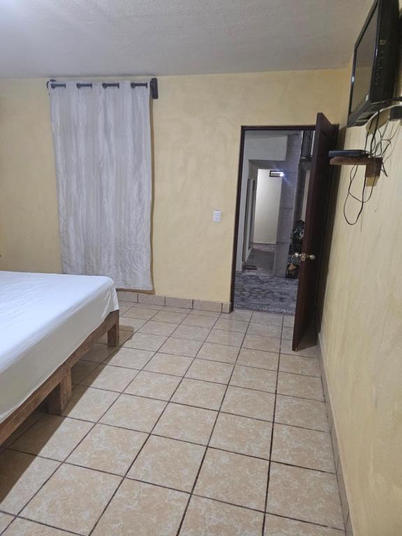 Postel nebo postele na pokoji v ubytování Hotel villas la aurora