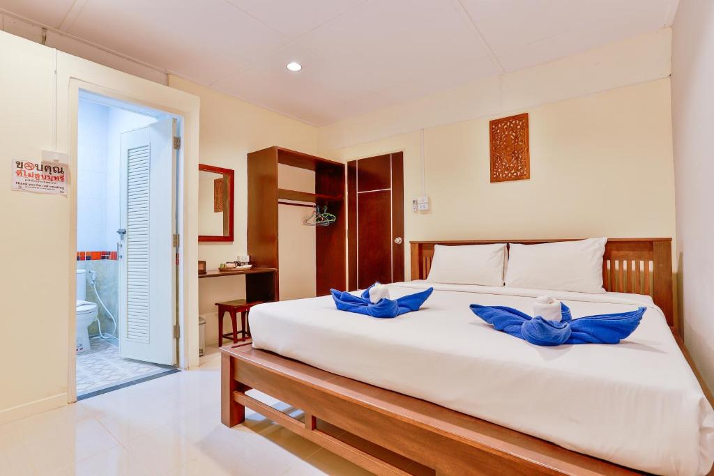 Postel nebo postele na pokoji v ubytování Aonang Privacy Resort