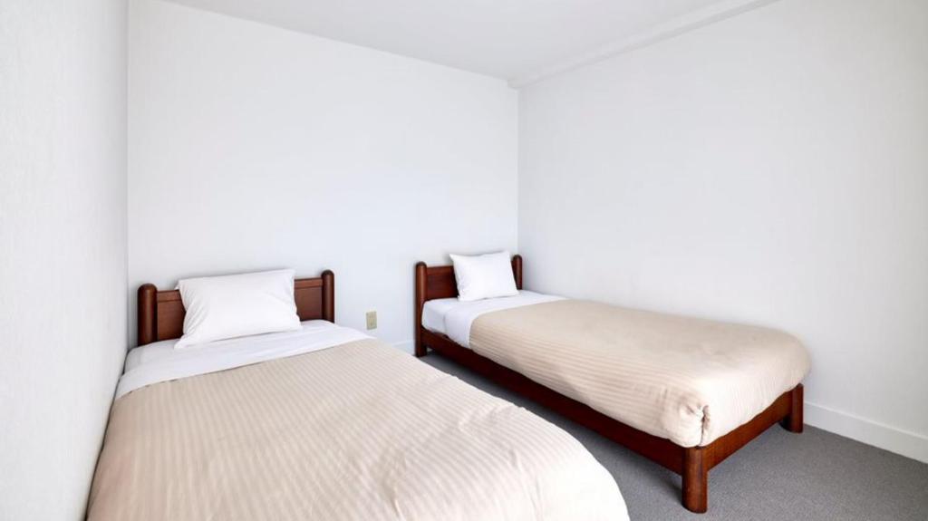 Postel nebo postele na pokoji v ubytování Hotel WWJ