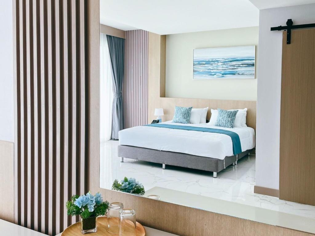 Postel nebo postele na pokoji v ubytování Sand Dance Hotel