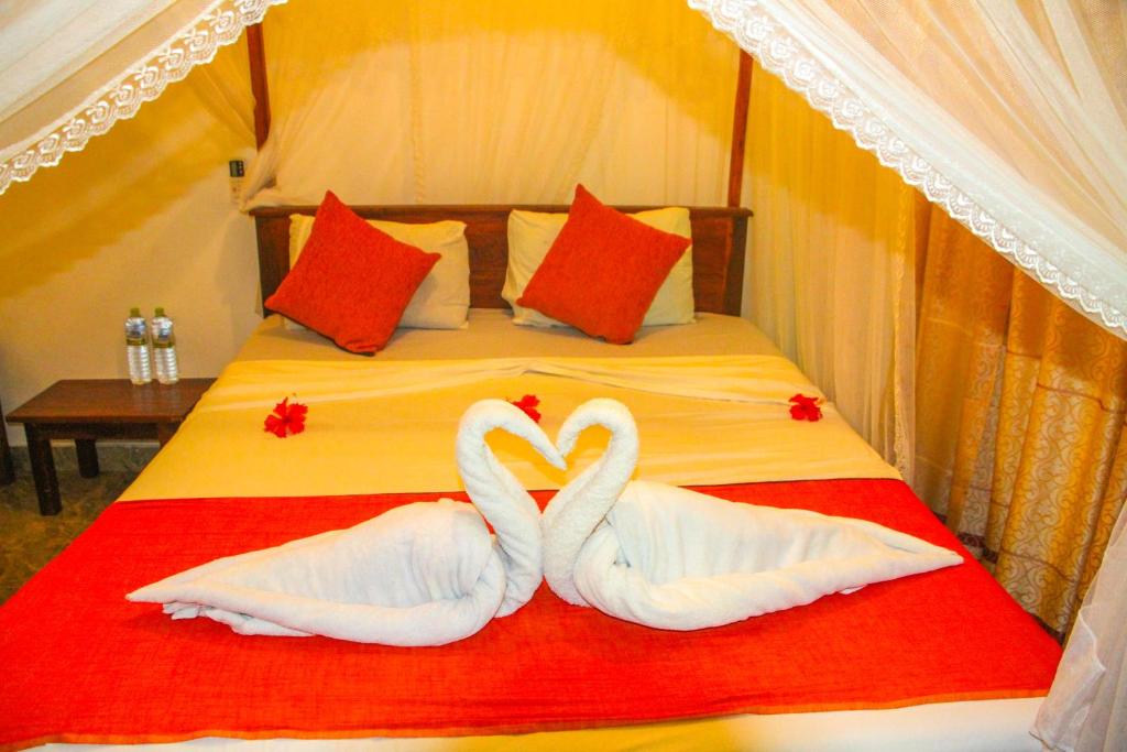 Postel nebo postele na pokoji v ubytování Kolon Resort Sigiriya