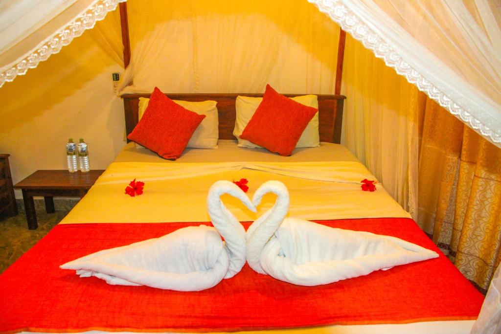 Postel nebo postele na pokoji v ubytování Kolon Resort Sigiriya