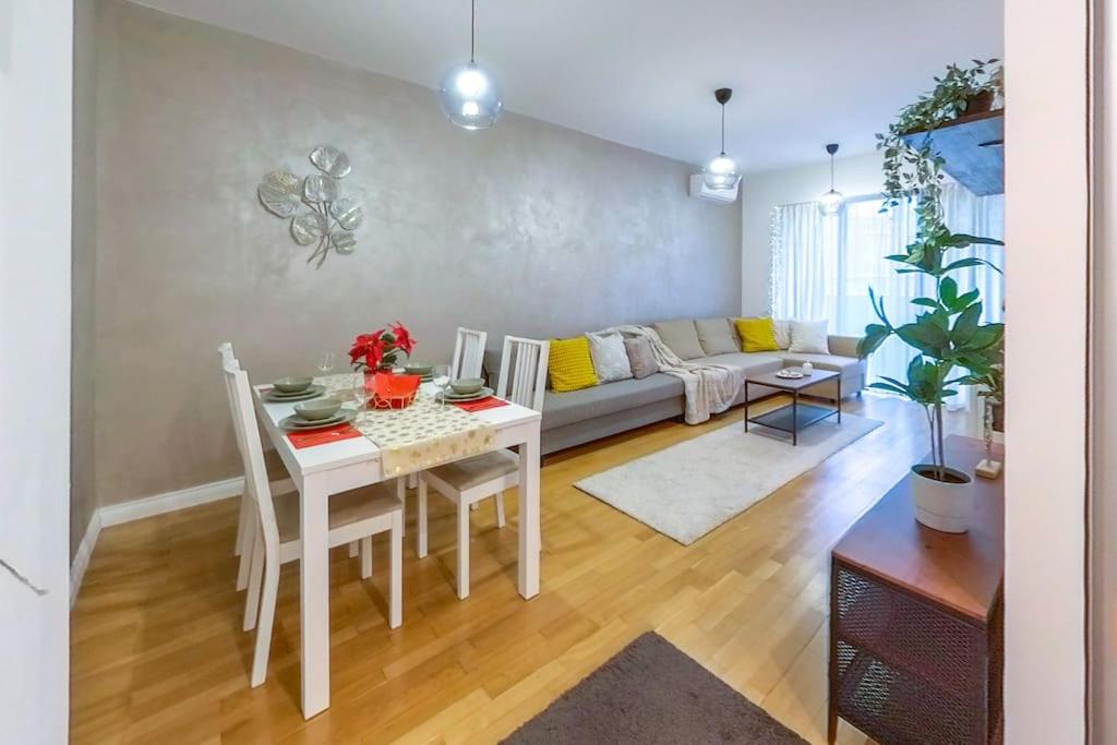 a living room with a table and a couch at Old Town Spacious Apartment in Bucharest
