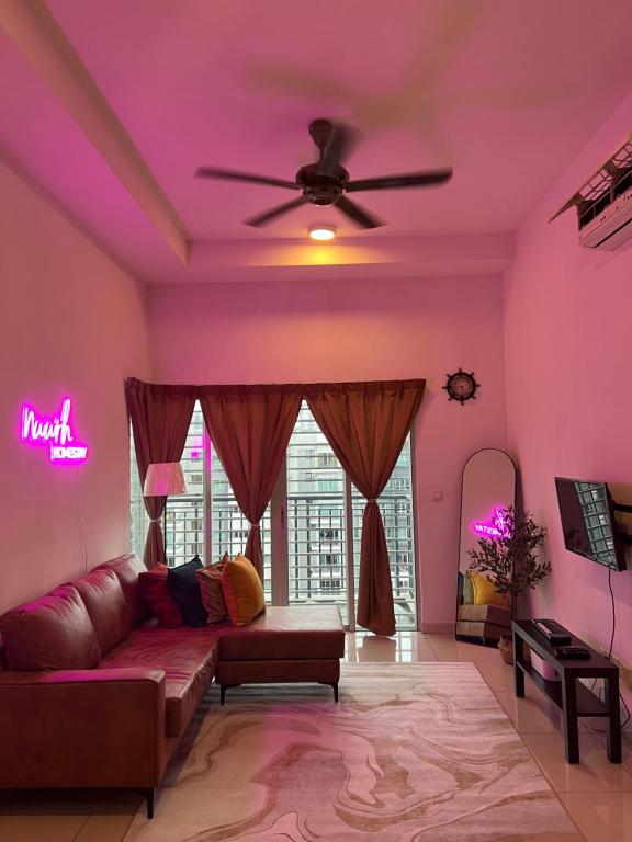 a living room with a couch and a ceiling fan at Nawwarah Homes @ Southville City (WiFi + NETFLIX) in Kajang