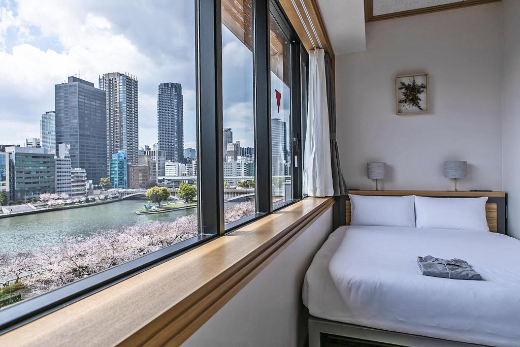 Postel nebo postele na pokoji v ubytování Hotel Noum OSAKA