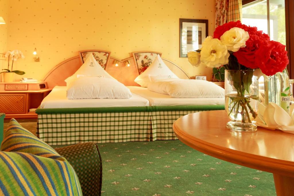 Postel nebo postele na pokoji v ubytování Garden Hotel Reinhart