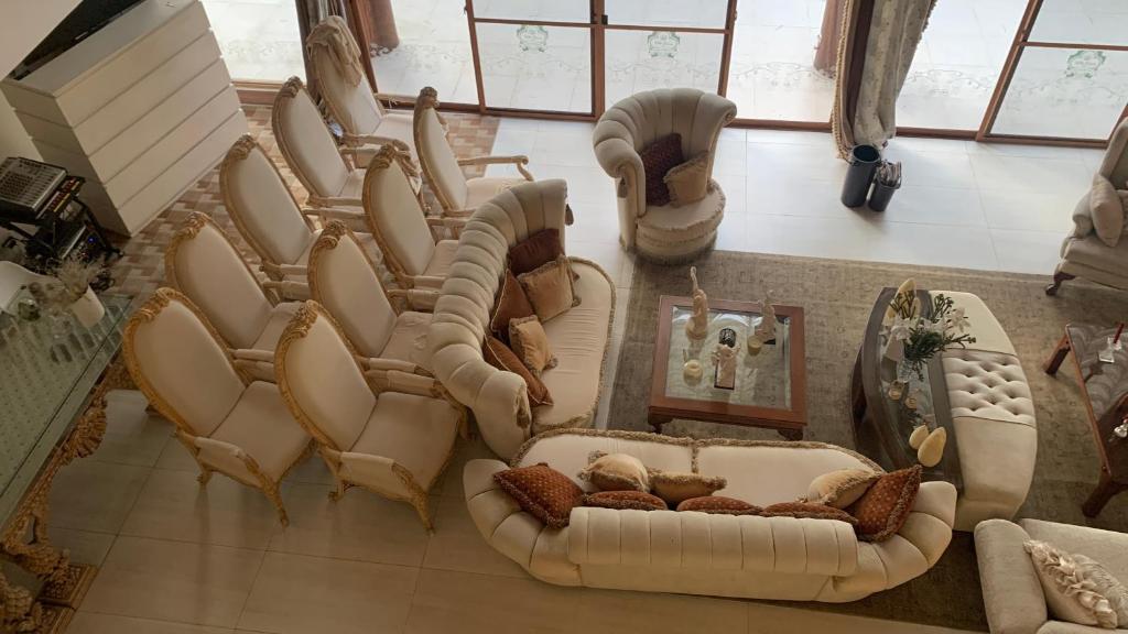 an overhead view of a living room with couches at Anang Balay Turista in El Nido