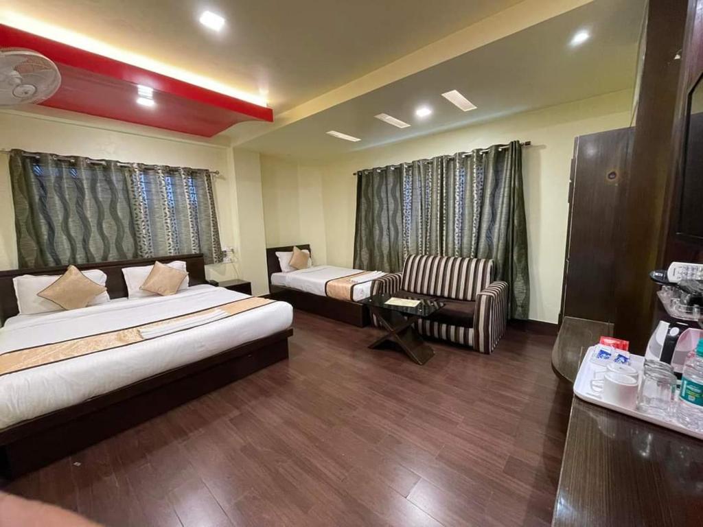 Postel nebo postele na pokoji v ubytování Hotel Sundaram Palace