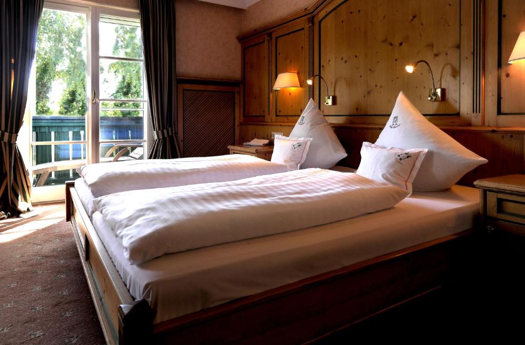 Postel nebo postele na pokoji v ubytování Garden Hotel Reinhart