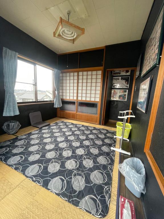 Postel nebo postele na pokoji v ubytování Jiji-Baba house