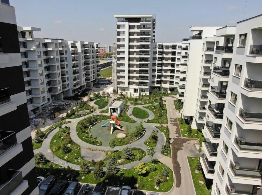 an aerial view of a park in between two buildings at Uptown Elegant Apartment in Voluntari