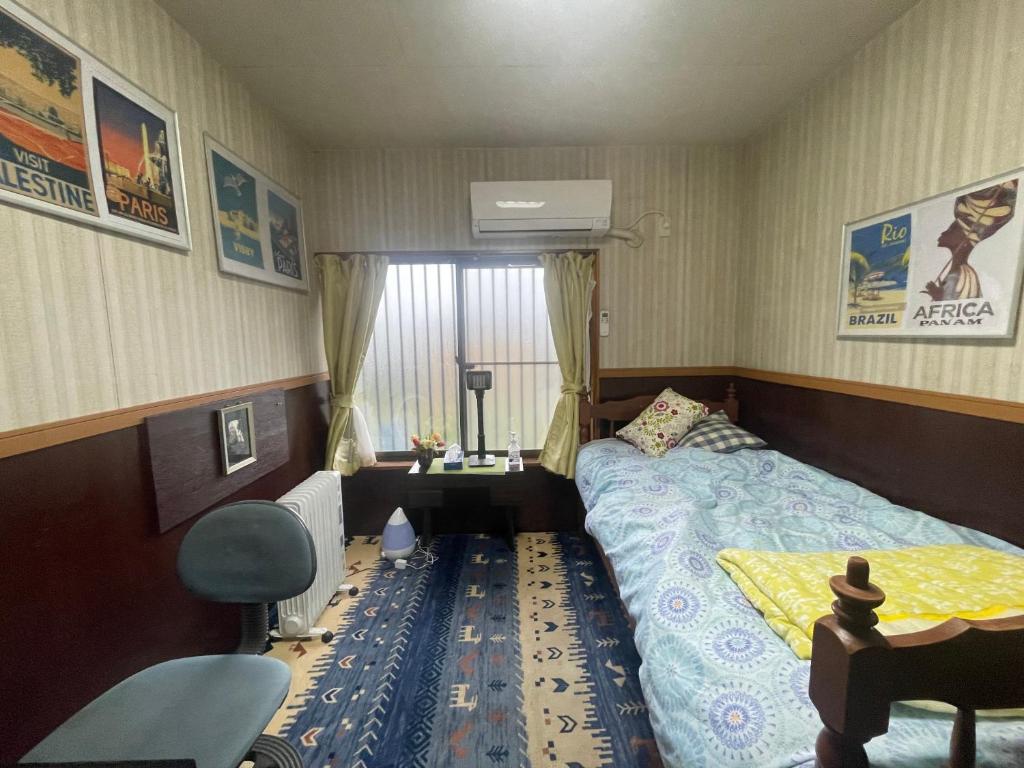Postel nebo postele na pokoji v ubytování Jiji-Baba house