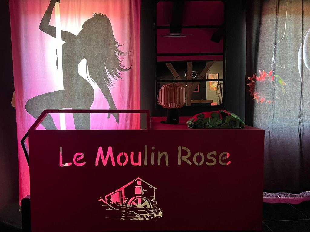 a sign that says le mountain rose in front of a pink curtain at Love Room du Moulin Rose in Trans-en-Provence