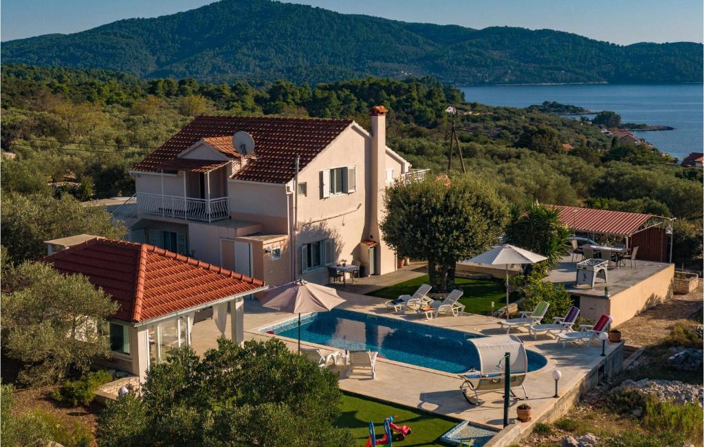 an aerial view of a house with a swimming pool at Nice Home In Stratincica With Wifi in Vela Luka