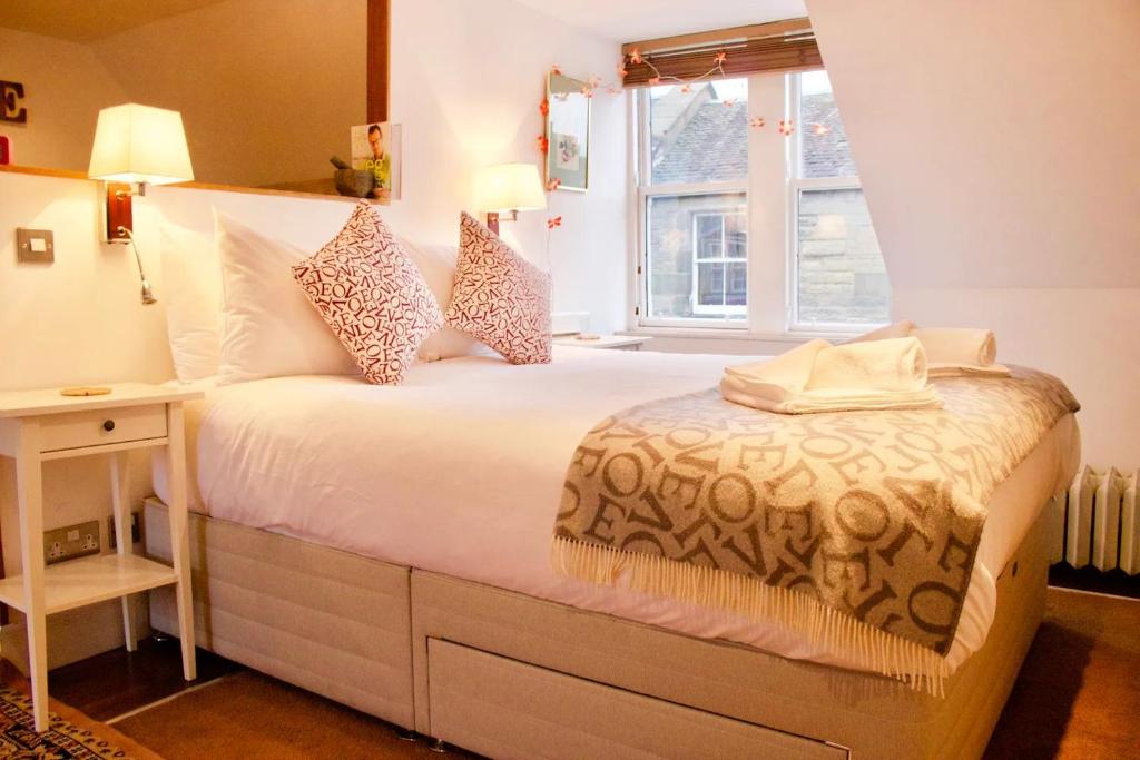 Llit o llits en una habitació de Pass the Keys Cosy Studio Apartment