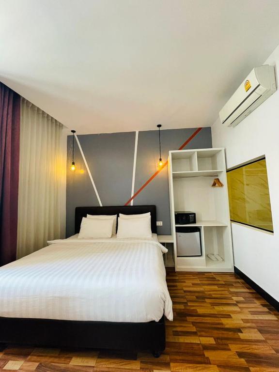 Postel nebo postele na pokoji v ubytování DE Hotel