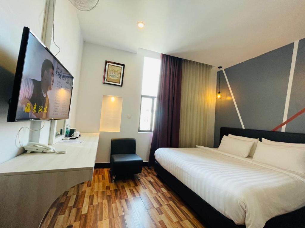Postel nebo postele na pokoji v ubytování DE Hotel