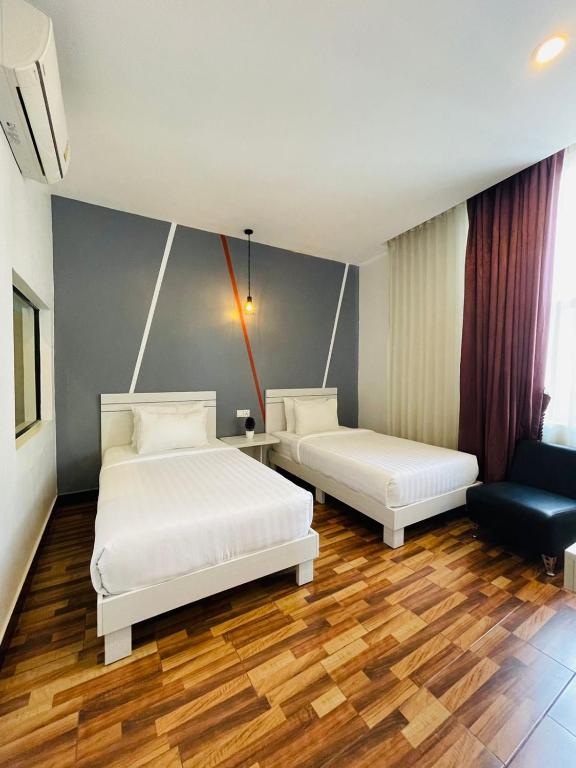 Postel nebo postele na pokoji v ubytování DE Hotel