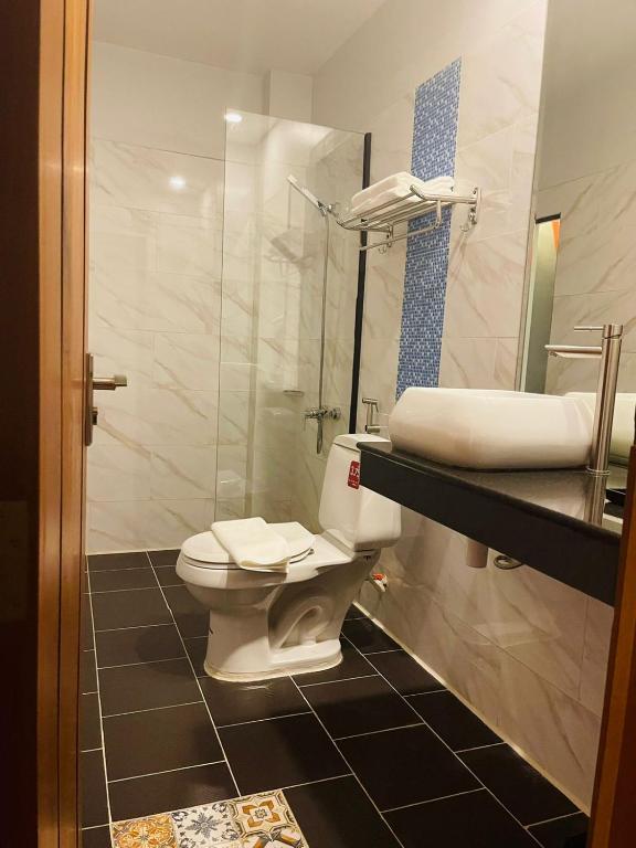 Koupelna v ubytování DE Hotel
