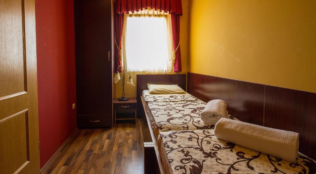 Postel nebo postele na pokoji v ubytování Apart hotel Samardzic