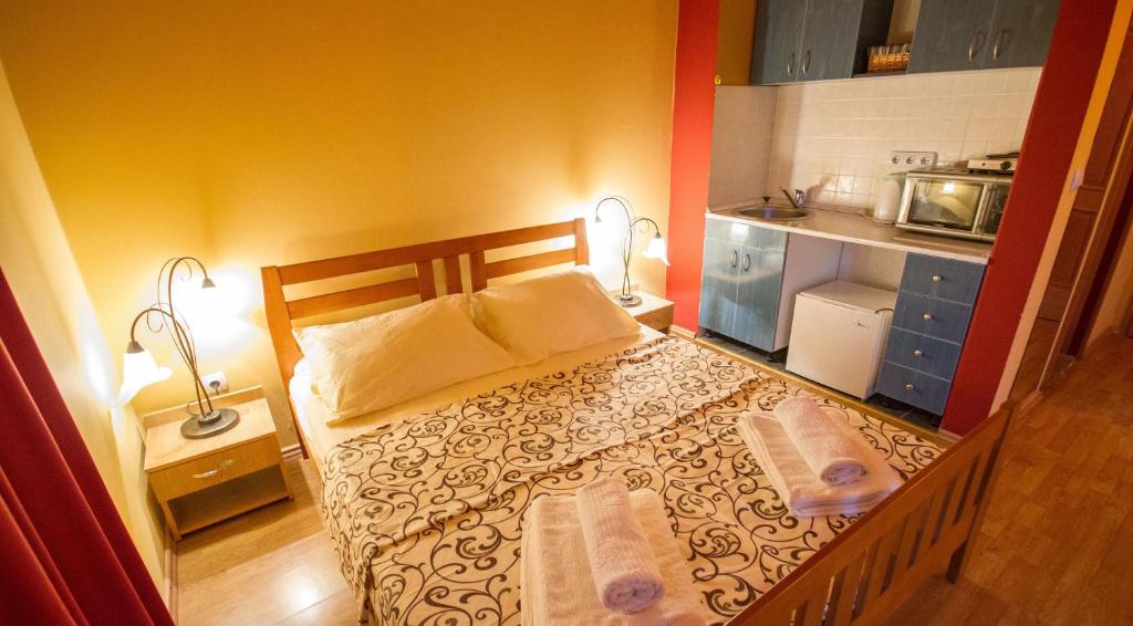 Postel nebo postele na pokoji v ubytování Apart hotel Samardzic
