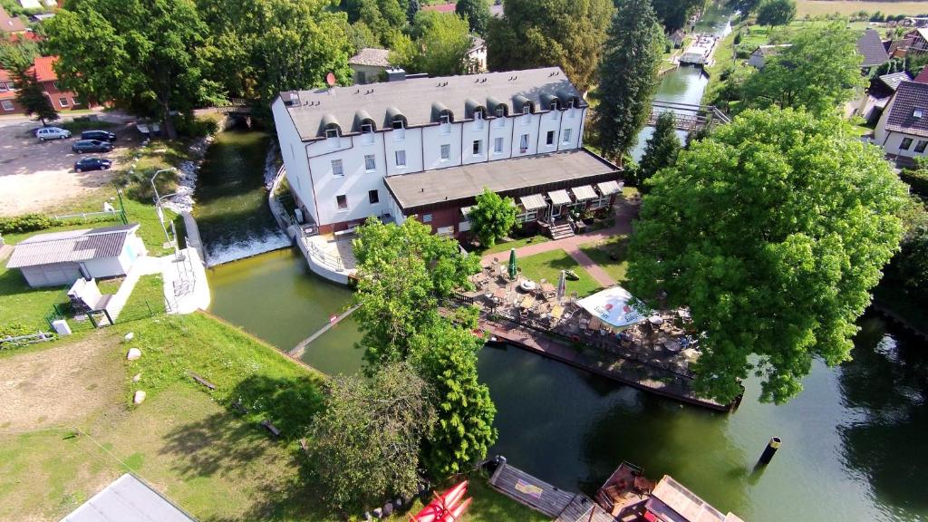 an aerial view of a building next to a river at Seehotel Zum Löwen in Strasen