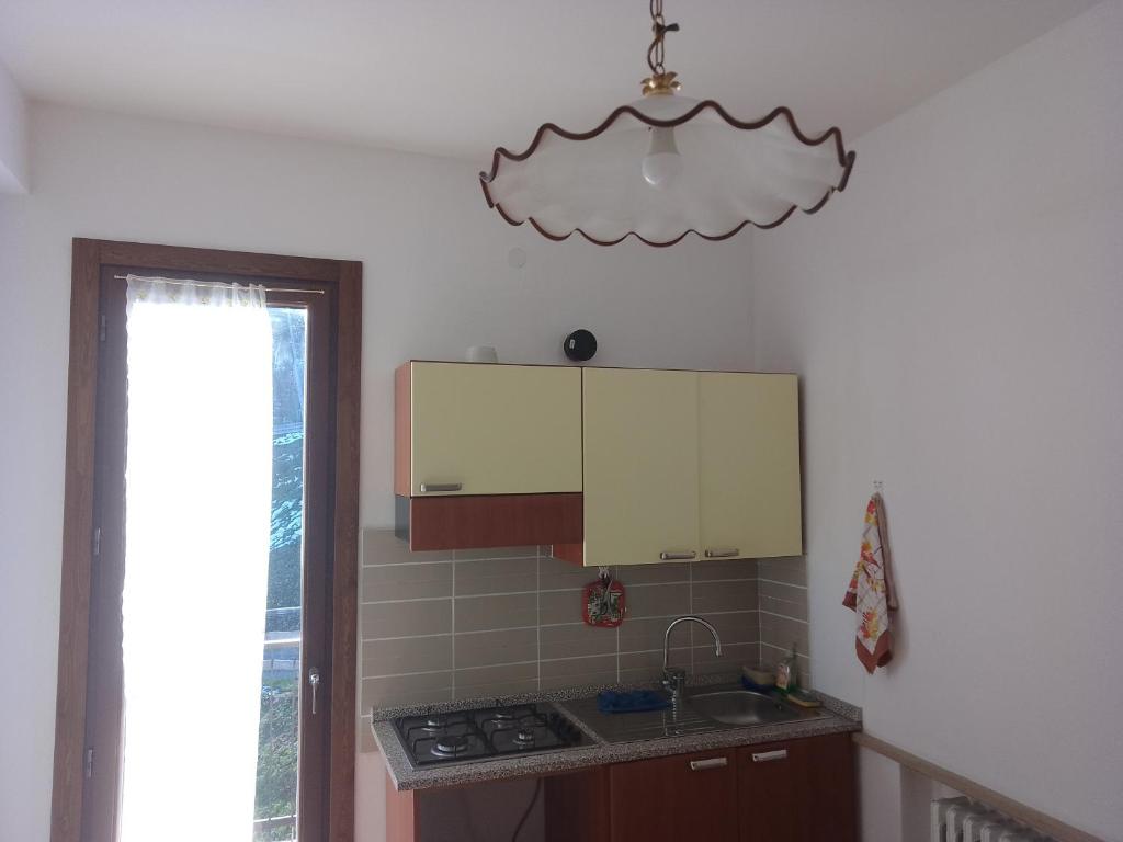 a kitchen with a sink and a counter top at Casa Artemis (Artemis House) in Cerreggio