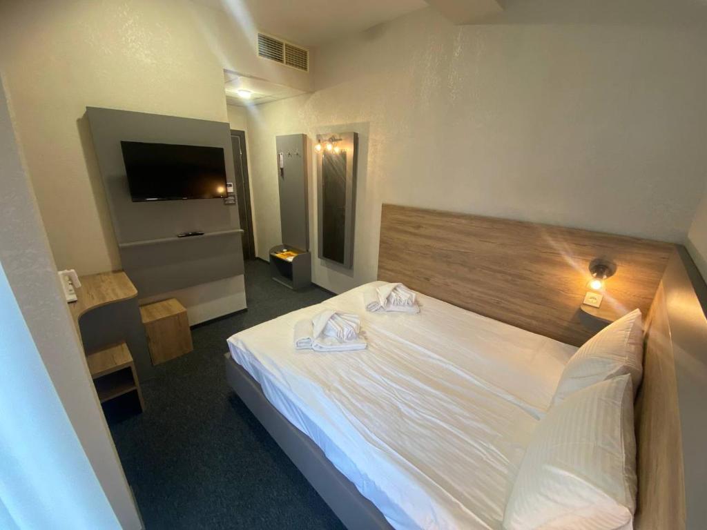 Postel nebo postele na pokoji v ubytování HOTEL ARTA