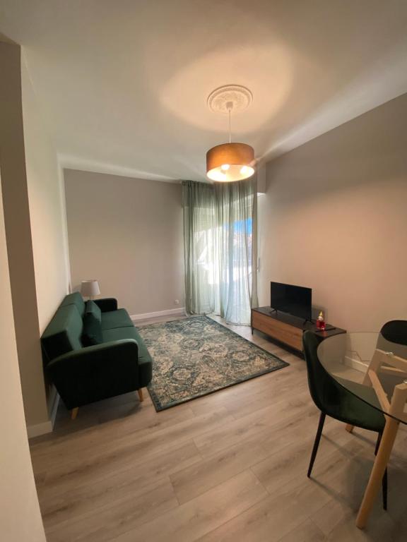 a living room with a couch and a table at Appartamento SOLARIUM in Rapallo
