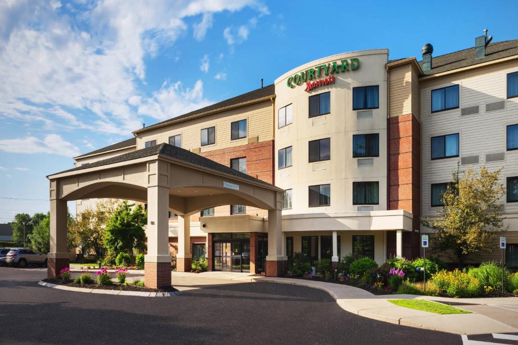 a rendering of a hotel with a gated entrance at Courtyard by Marriott Portland Airport in South Portland