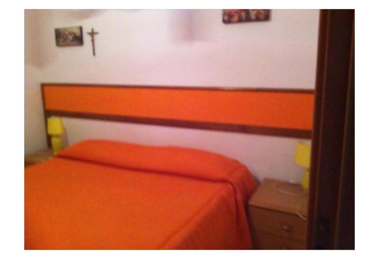 Postel nebo postele na pokoji v ubytování Residence La Quiete