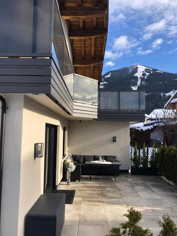 a balcony of a house with a view of a mountain at Appartement Edelschwarz in Westendorf