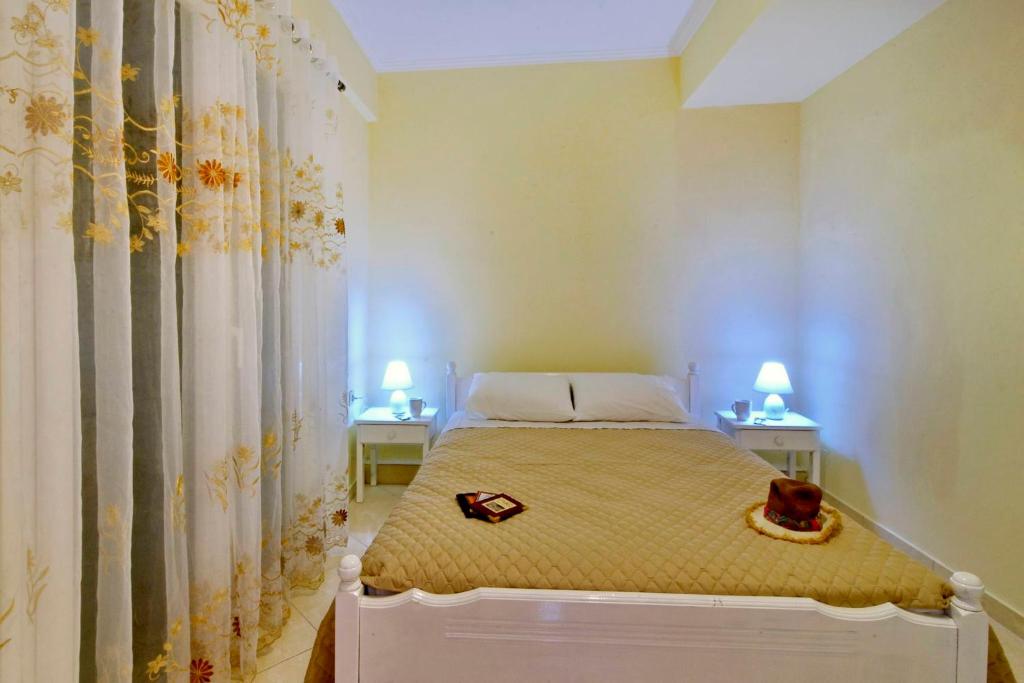 Postel nebo postele na pokoji v ubytování SG Suites Corfu, A