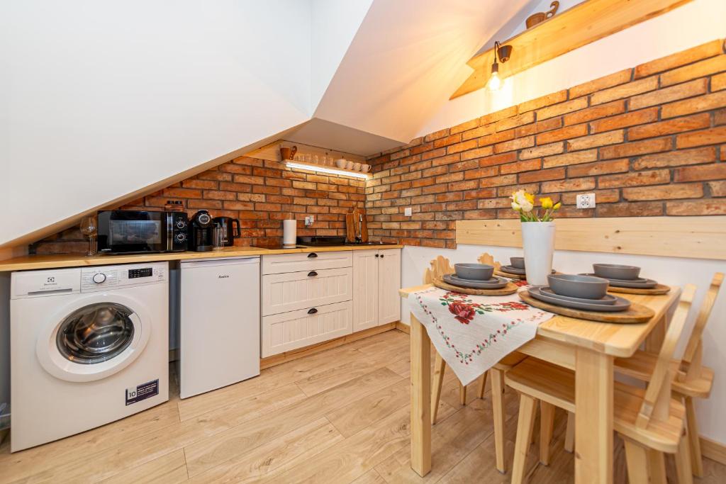 Kuchyňa alebo kuchynka v ubytovaní Apartamenty Zakopiańska Polana
