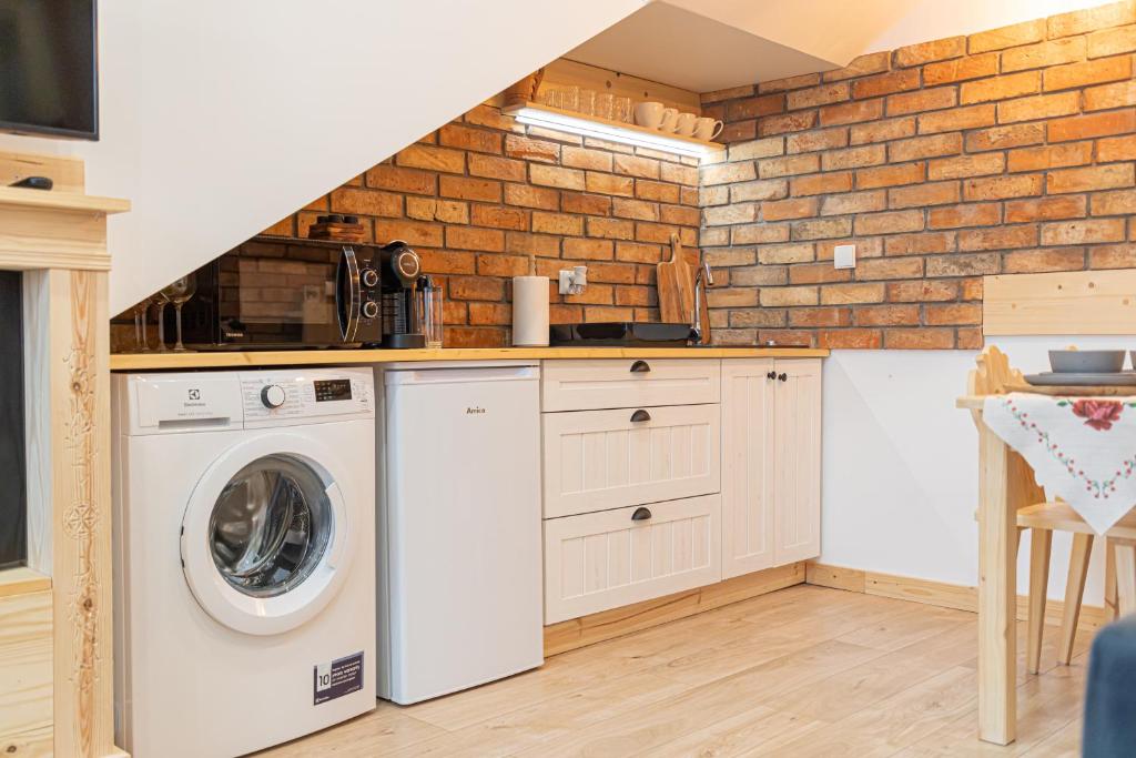 Kuchyňa alebo kuchynka v ubytovaní Apartamenty Zakopiańska Polana