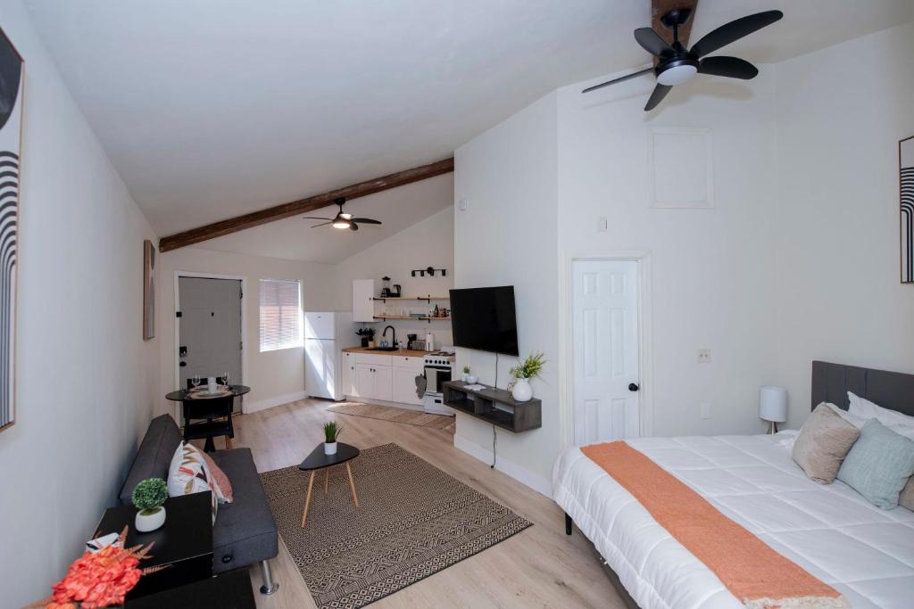 a bedroom with a bed and a living room at Modern Studio Type Apt close to Botanical Gardens in Huntsville