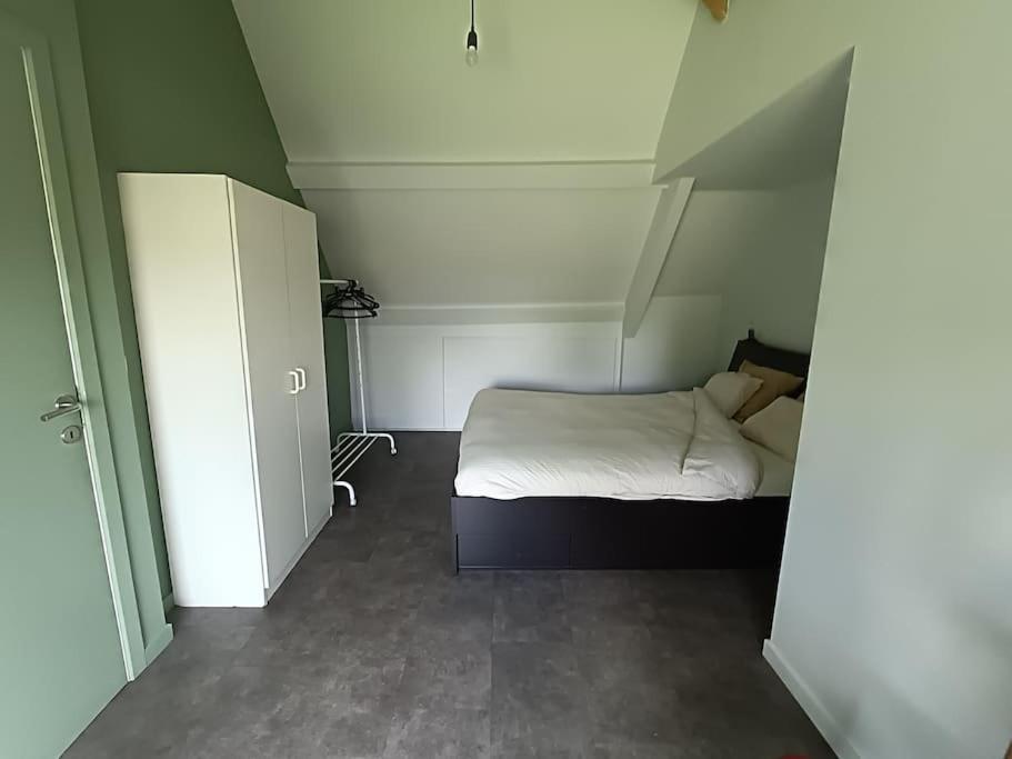 Postel nebo postele na pokoji v ubytování Huis Belijn
