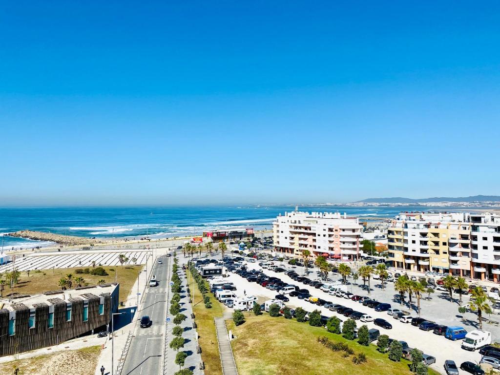 an aerial view of a city with the ocean at Caparica Sea View Apartment in Costa da Caparica