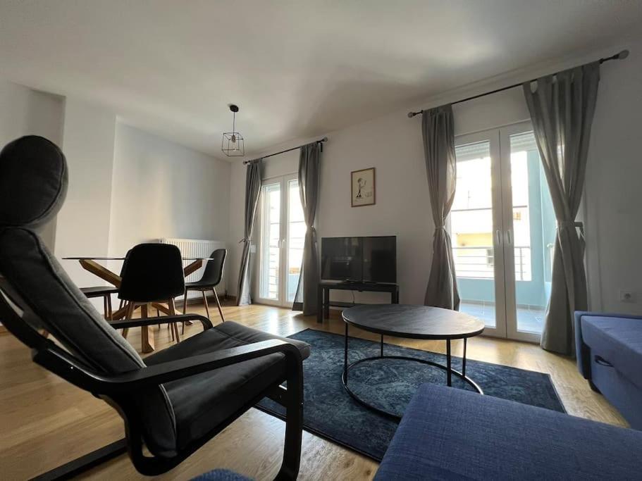 a living room with a couch and a table at Iris Luxury Apartment in Ioannina
