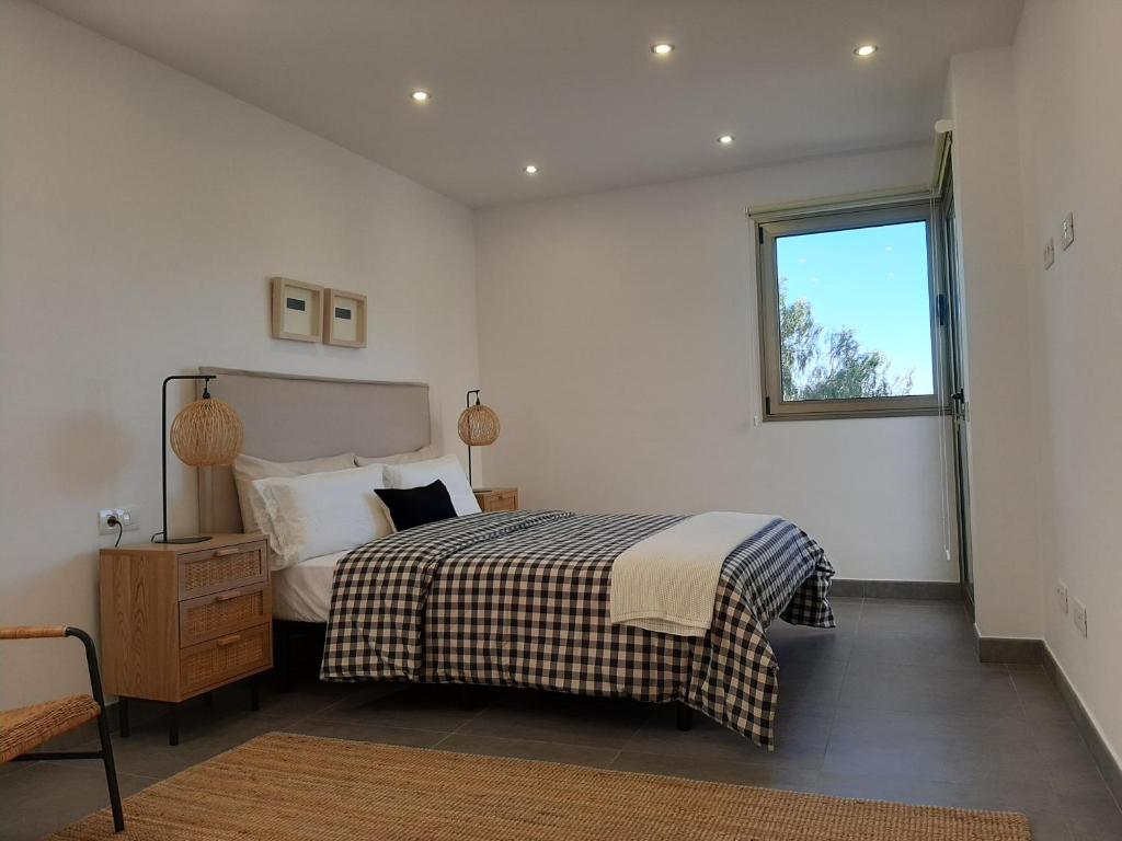 En eller flere senger på et rom på Casa Argeo