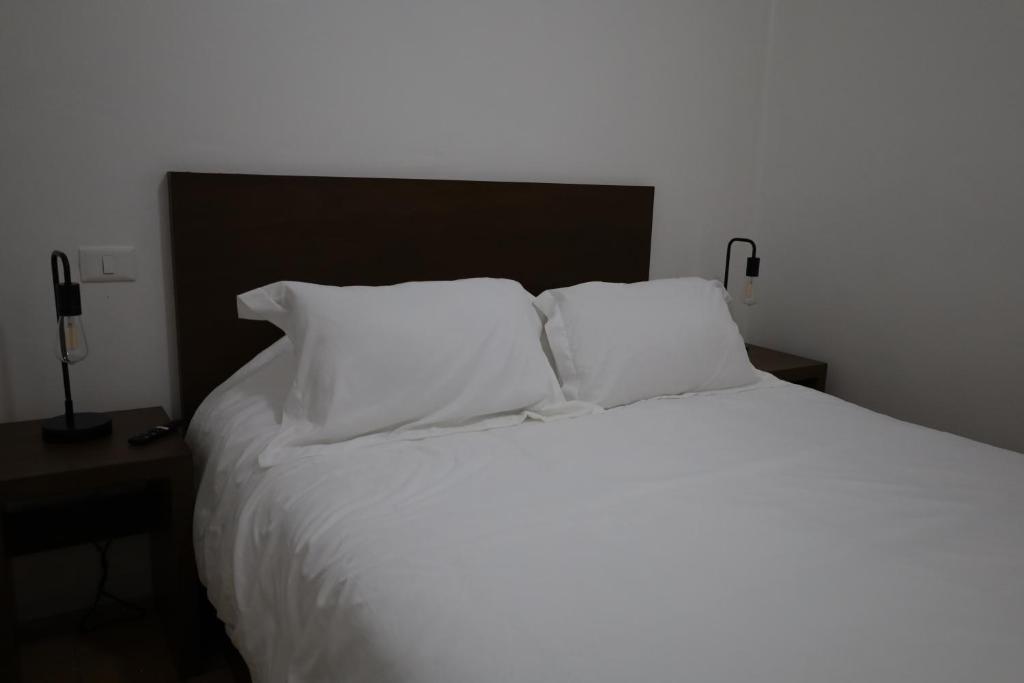 Postel nebo postele na pokoji v ubytování Hotel Mado