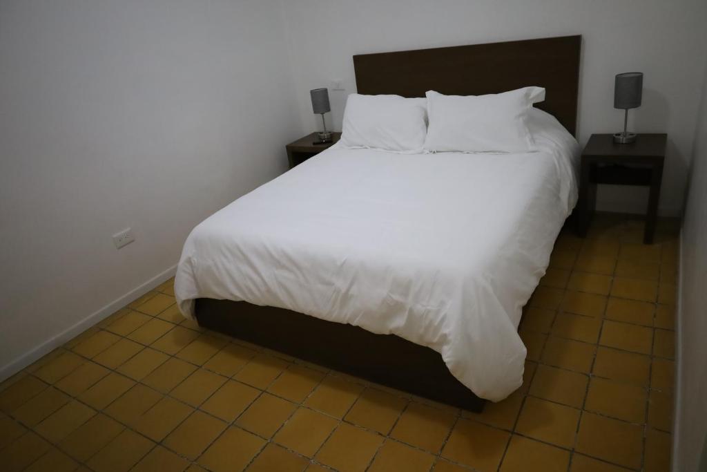 Postel nebo postele na pokoji v ubytování Hotel Mado
