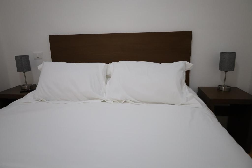 Postel nebo postele na pokoji v ubytování Hotel Mado