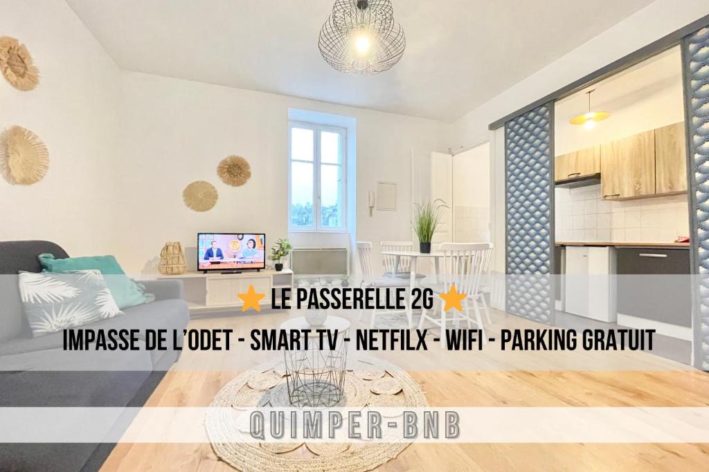 a living room with a couch and a kitchen at LA PASSERELLE 2G - Quartier Gare - Wifi - Parking in Quimper