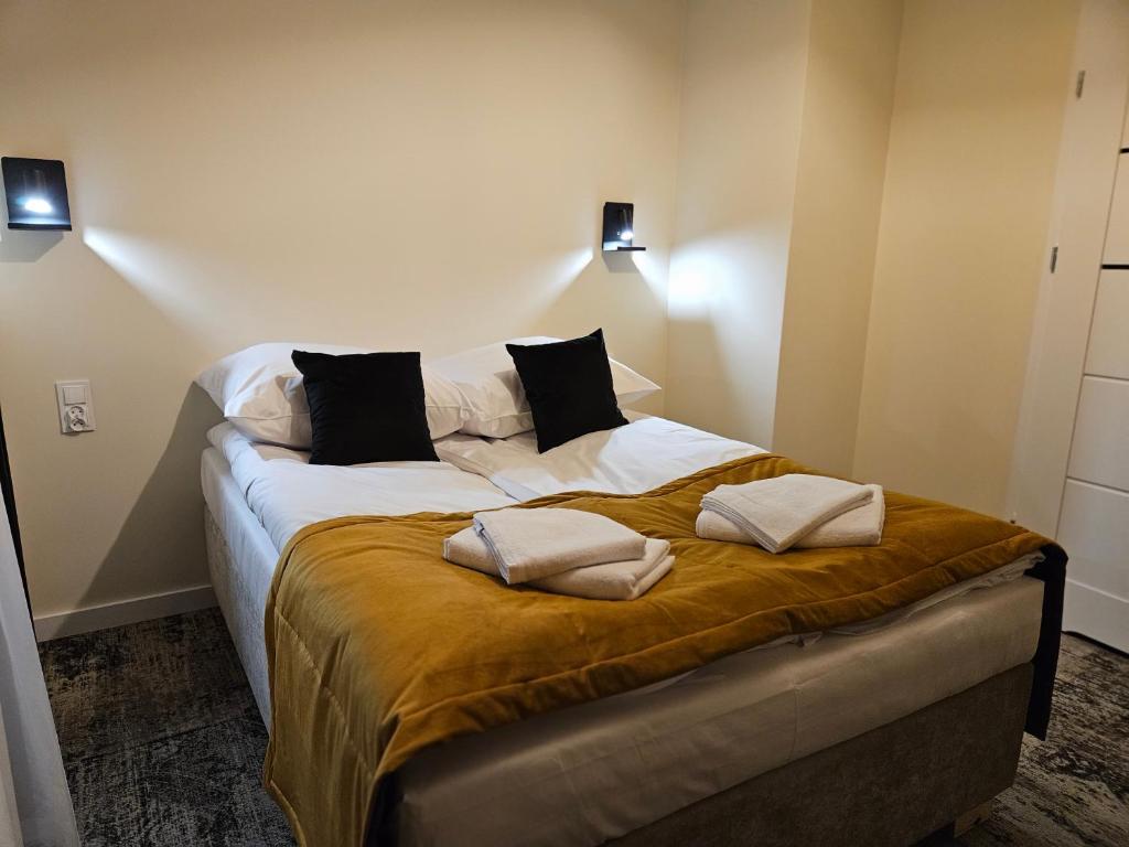 Postel nebo postele na pokoji v ubytování ApartHotel Centrum - parking free