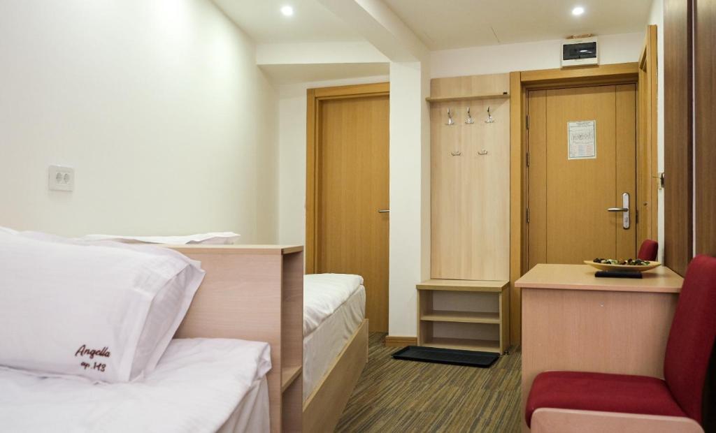 Postel nebo postele na pokoji v ubytování Apartments Pavle