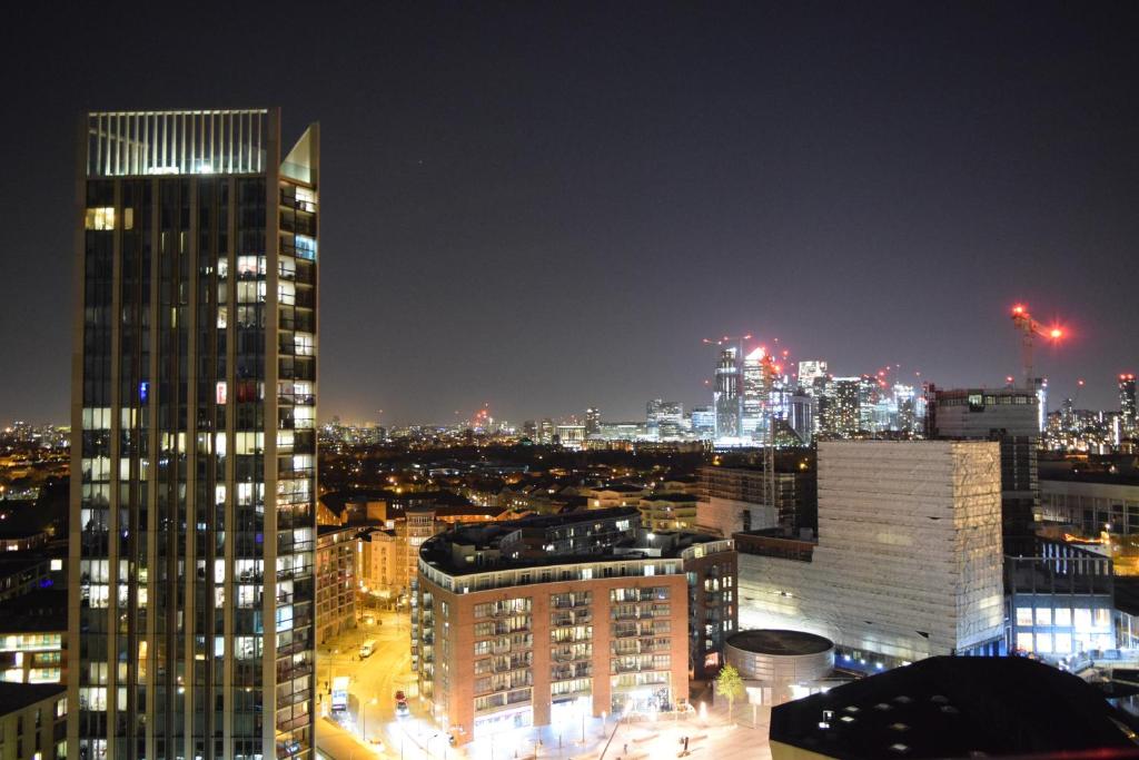 a view of a city skyline at night at Central Room with Stunning Views in London