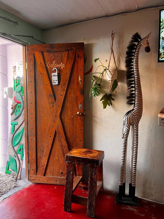 TV a/nebo společenská místnost v ubytování Boho by Arte Hostal Boquete