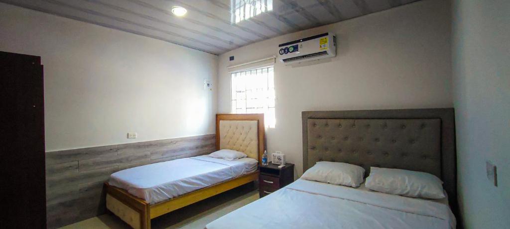 מיטה או מיטות בחדר ב-Juliana Casa Turistica